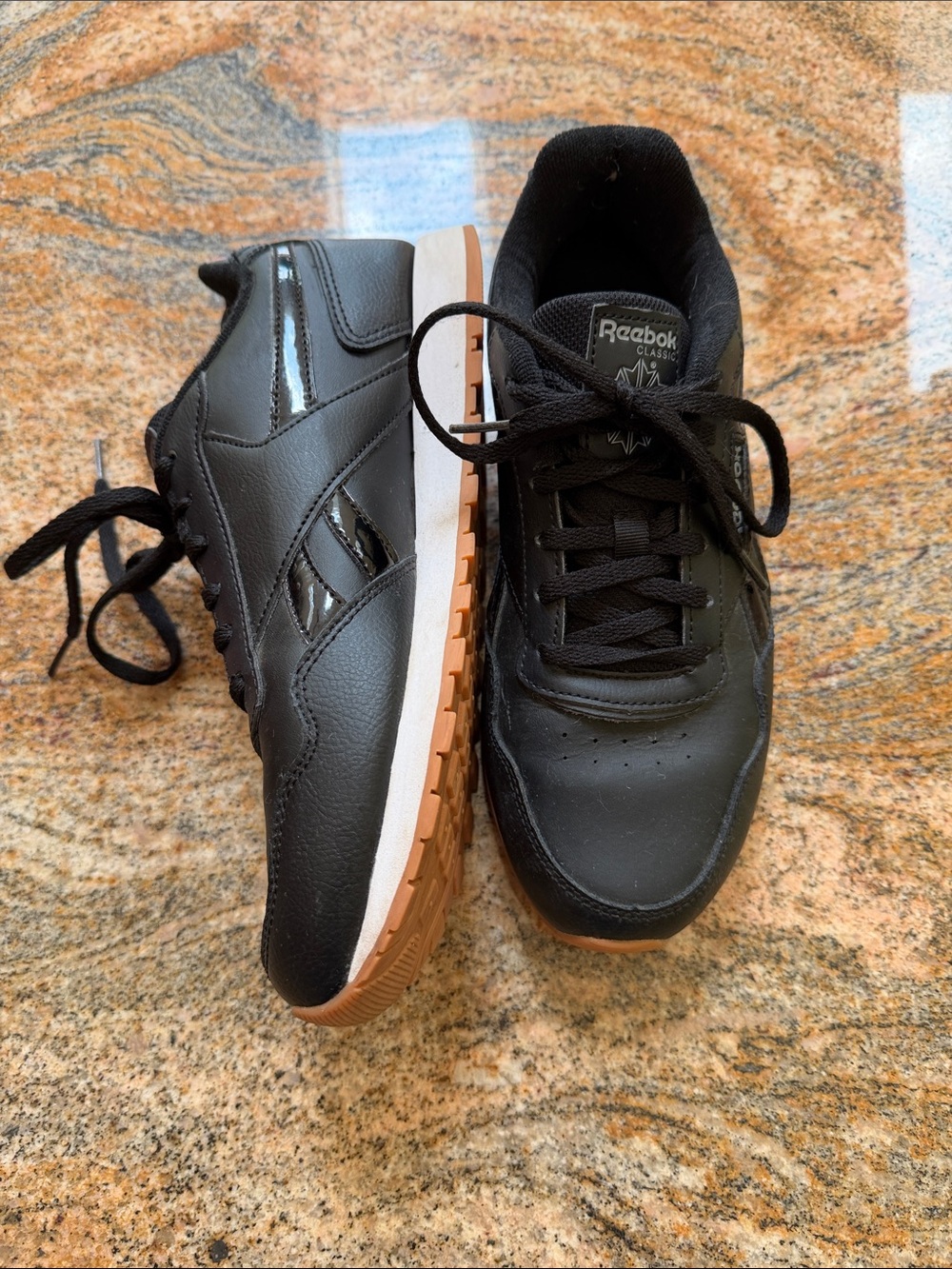 Reebok Women's Black Sneakers with tiger print accent
